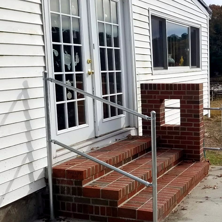 Brick entry steps with brick pier at a home