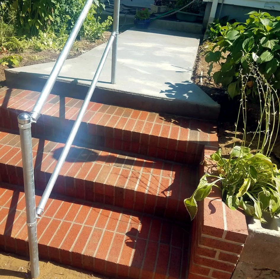 Brick steps leading to a concrete landing
